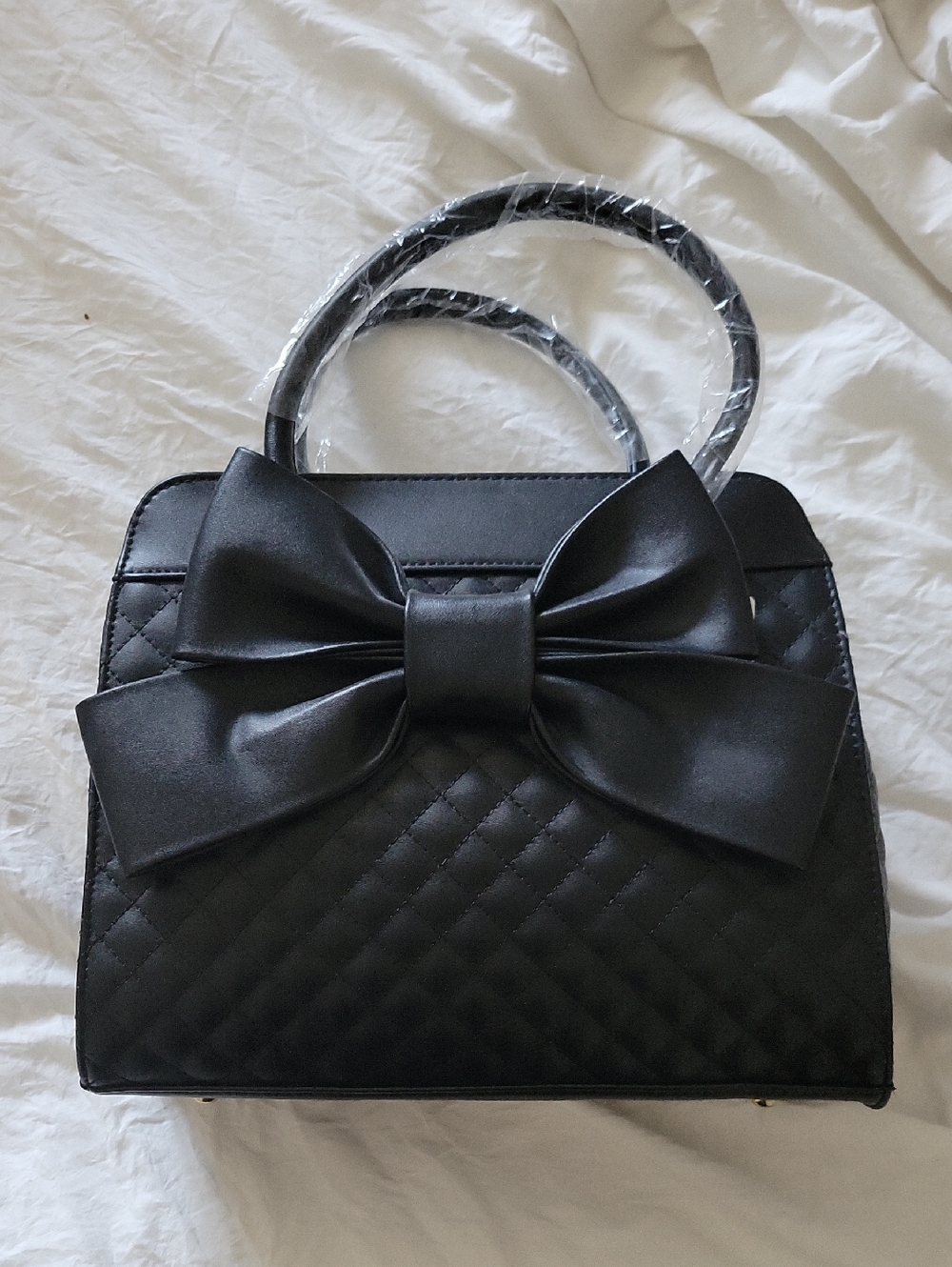Black Bow-Accent Quilted Top-Handle Bag